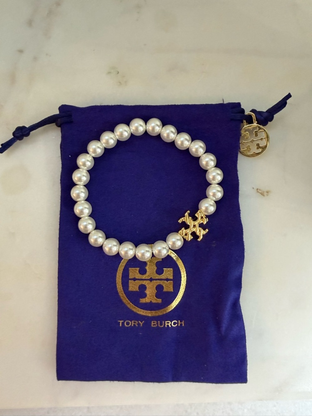 Tory Burch White Pearl Stretch Bracelet with Gold Logo Charm